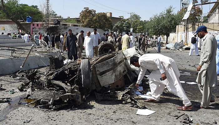 Pakistani security officials inspect the site of a powerful explosion that targeted a police vehicle in Quetta – Photo AFP