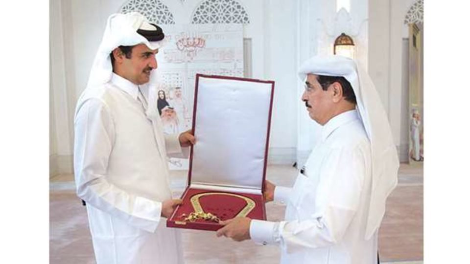 Emir of Qatar Sheikh Tamim bin Hamad AlThani decorates Dr Hamad bin Abdulaziz AlKuwari with Sash