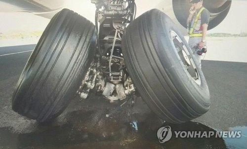 Landing gear on a B777-300 damaged making a normal landing at Narita Intl Airport June 29, 2018.