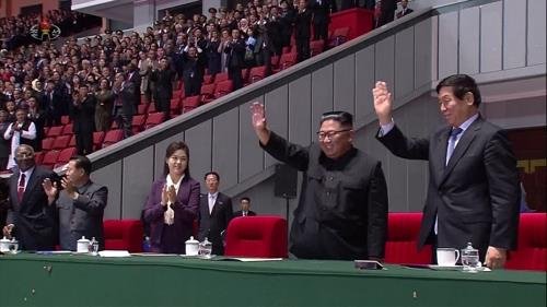 Kim Jong-un and China’s special presidential envoy Li Zhanshu waving before watching a mass gymnastics performance in Pyongyang on Sept. 9, 2018.